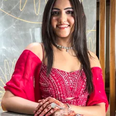 The complete look, showcasing the beautiful hair, makeup, and traditional henna. She is ready to turn heads at her event.