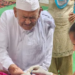 An elderly gentleman getting his blood sugar checked at our medical camp. Regular check-ups are vital for early detection and management of conditions like diabetes.