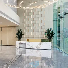 The reception lobby at Brookfield, Candor TechSpace, designed to create a striking first impression. We combined a sculptural marble desk, warm lighting, and refined materials to craft a space that speaks of contemporary sophistication and corporate elegance.