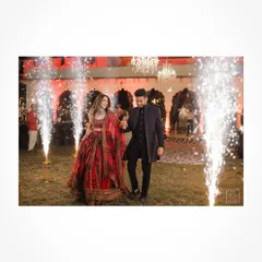 The couple makes a grand entrance with sparklers at their Sangeet night in Jaipur.