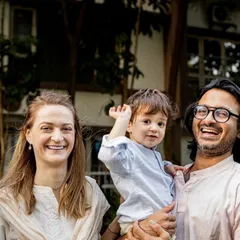This is what a relaxed, happy family portrait looks like. We were just chatting and laughing in the garden, and I captured this beautiful, candid moment. It shows their connection without any formal posing.