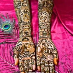 Another angle of this stunning bridal piece, showing how the elements flow from the forearm to the fingertips. The peacock feather adds a touch of grace.