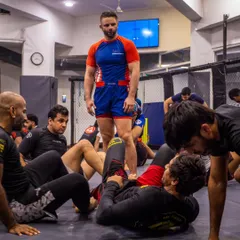 A wide shot of our BJJ seminar, with students and coaches alike absorbing knowledge from a world-class practitioner. The learning never stops at Warrior's Cove.