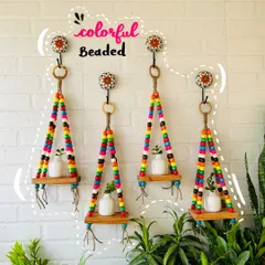 Explore our collection of macrame wall shelves, handwoven with love and lots of colorful beads. This image features our 'Colorful Macrame Beaded' wall shelves.