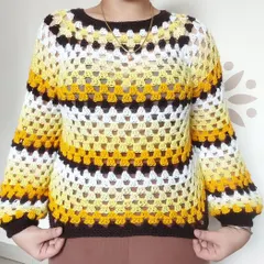 A classic granny stitch sweater is a cozy wardrobe essential. I created this piece with a vibrant, striped color scheme and balloon sleeves, but I can customize the colors and fit to match your personal style perfectly.