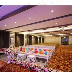We blend spectacular decor with functional design. This seating arrangement at Mohan Banquets features comfortable lounge sofas with colorful cushions, lined with a beautiful floral border.