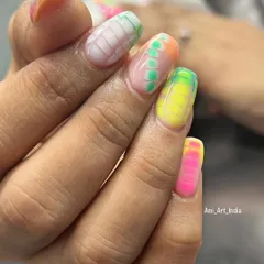 A closer look at the vibrant colors and patterns of this Holi-inspired nail art set.