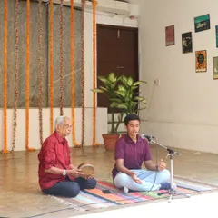A young vocalist performs with his guru during the "Platform Performances" showcase, embodying the Guru-Shishya tradition.
