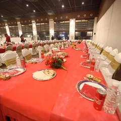 A closer look at the table setup at Anantia Palace Ground. Each place setting is neatly arranged, showing my attention to detail in preparing for a large number of guests.