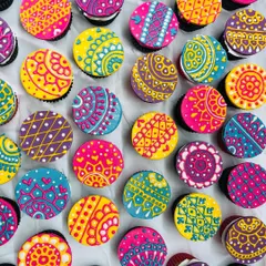 Holi Hai! These are my special Holi-themed cupcakes with vibrant, hand-piped henna-style designs. They are as colorful as the festival itself.