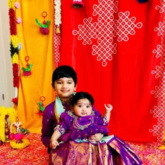 Seeing my creations bring families together is the best feeling. These adorable siblings are twinning in custom purple Kanchi pattu outfits, with the brother in a smart kurta-dhoti and his baby sister in a matching pattu pavadai.