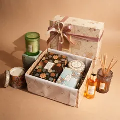 A beautifully composed gift set featuring a variety of our home fragrance products. The mix of candles, diffusers, and our signature packaging makes this a versatile and luxurious gift for anyone.