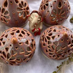 More festive tea light holders, ready to light up your home during Diwali. I love the rich colors and the way the light shines through the patterns.