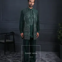 The full view of the emerald kurta set and embroidered jacket. The straight cut and mandarin collar are hallmarks of my impeccable craftsmanship.