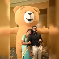 Our giant brown Teddy Bear gives the warmest hugs, making it a perfect addition to weddings and family functions. Here it is creating a sweet moment with guests.