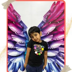 Our studio's angel wings aren't just for girls. This little boy looks cool and confident posing for his picture.