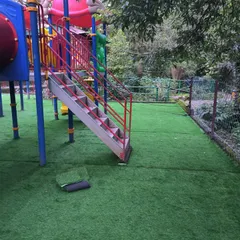 Work done at the children's park in Nainital. The artificial grass provides a safe, cushioned surface under the play equipment.