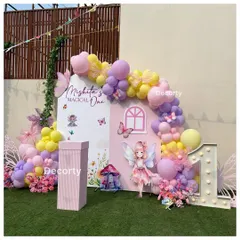 Welcome to Mishita's "Magical One" fairy-themed party. This beautiful backdrop features a fairy house, pastel balloons, floral details, and a light-up number one.