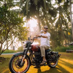 A morning shot with a custom Royal Enfield, bathed in the soft Goan sunlight. The focus here is on the relaxed, adventurous lifestyle associated with the brand, making the product feel like a natural part of the scenery.