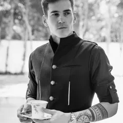 This black bandhgala shirt from our 'Metal Bling' collection features sharp metal accents and a modern, edgy design, perfect for a cocktail evening.