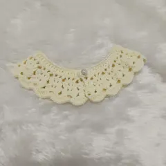 This is a more delicate, lacy crochet collar in an off-white color with a single pearl button. I was so grateful when a customer came to pick this up personally in the pouring rain.