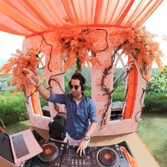 Crafting the perfect vibe for a sun-drenched sundowner party. My goal is to match the music to the beautiful setting, creating a relaxed yet celebratory atmosphere for everyone.