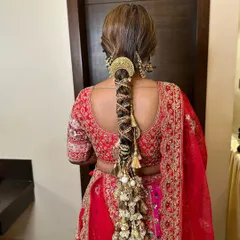 A stunning, heavily accessorized braid for the wedding day. This is a true statement hairstyle, perfect for a bride who wants a look of royal grandeur.