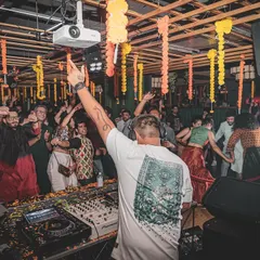 The energy of a Sangeet night is unbeatable. Here I am, commanding the dance floor from the console, ensuring the music flows perfectly as family and friends perform and celebrate.