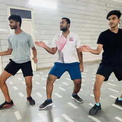 Footwork is the foundation of fencing. Our senior fencers practice their 'en garde' stance and movement, ensuring perfect balance and readiness for both epee and sabre.