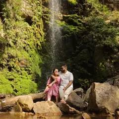 We found a hidden waterfall near Rishikesh for this romantic shot. The lush green moss and flowing water created a perfectly natural and serene setting for this couple's pre-wedding portraits.