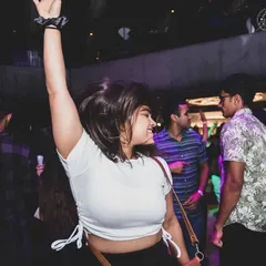 A happy dancer caught in the moment during a Saturday night set. Creating a fun and energetic atmosphere where everyone feels free to dance is what I do best.
