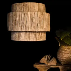 The same tiered fiber lampshade, unlit. This view allows you to appreciate the raw, rustic texture of the material and the simple, modern geometry of its three-tiered form.