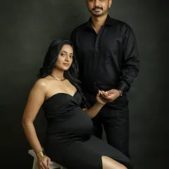 A powerful and chic studio portrait. Dressed in matching black, you both exude confidence and style. This is a modern and sophisticated way to capture your maternity journey.