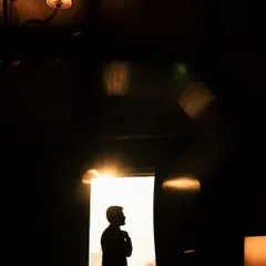 I am always chasing the light. This silhouette of a groom, framed by the doorway just before his reception, uses shadow and a sliver of golden hour sun to create a feeling of anticipation and quiet confidence.
