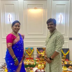 Mr. and Mrs. Pingulkar standing before the Vastu Shanti puja setup in their newly designed home. Their satisfaction is our measure of success.