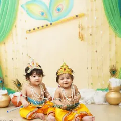 Double the trouble, double the love! These adorable twin boys are dressed as little Krishnas for their milestone photoshoot, creating a picture of divine cuteness.