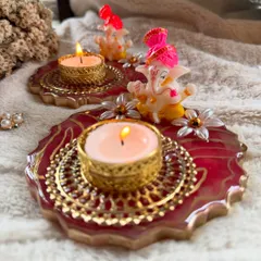 Another angle of the resin Ganesha diyas, showing the warm glow of the tealights. These pieces are designed to bring a divine and elegant touch to your home.