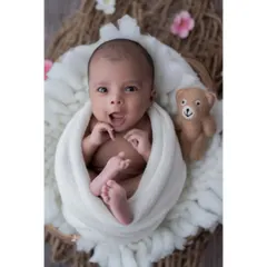 Hello, world! Not all magical moments happen during sleep. I love capturing the bright, curious eyes and expressive faces of awake newborns. This little one, nestled in a soft basket, seems ready to take on the world.
