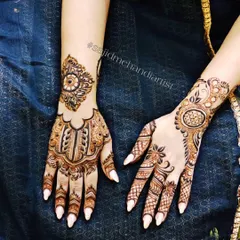 This is a great example of a modern, minimalist approach. The design is focused on the back of the hands, with distinct, separate motifs that are detailed yet not overwhelming.