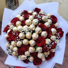A luxurious and indulgent bouquet made entirely of Ferrero Rocher chocolates and fresh red roses. This is a classic choice for making a grand romantic gesture.