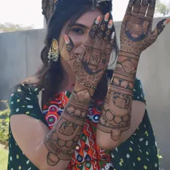 A playful shot from my mehndi ceremony, showing off the intricate designs that cover both my hands and arms.