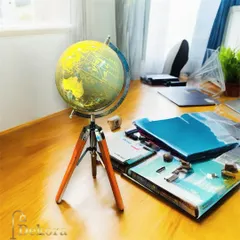 A closer look at the wooden tripod globe, highlighting its detailed map and compact size suitable for any desk. This piece combines educational appeal with decorative elegance.