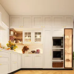 A timeless white kitchen with classic cabinetry and gold hardware. The design includes an integrated appliance tower for the microwave and oven, as well as a glass-front pantry for display and storage.