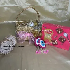 Celebrate Diwali with this festive basket filled with traditional treats. It includes a box of Dodha Burfi, decorative evil eye hangings, and fairy lights to add sparkle to the celebration.