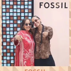 We love collaborating with top brands like Fossil for their special events. Here, guests at the Mother's Day celebration pose in front of a custom backdrop, with our Magic Mirror capturing the moment.