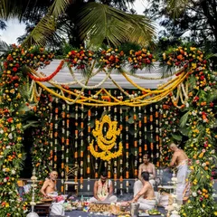For this traditional Hindu wedding, we designed a magnificent mandap featuring a Ganesha motif made entirely of marigolds, surrounded by lush floral garlands to create a sacred and vibrant space.