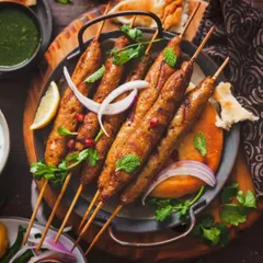 A vegetarian classic, perfected. Our Veg Seekh Kebabs are made with a blend of fresh, seasonal vegetables and aromatic spices, then grilled until tender and smoky. Served with a side of mint chutney.