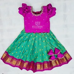 A classic Pattu Pavadai for newborns in pink and sea green, available for immediate dispatch.