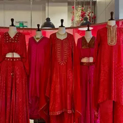 A sea of red and pink. This display from my Punit Balana collection features various silhouettes, from crop tops and skirts to classic kurtas, all in festive bandhani prints.
