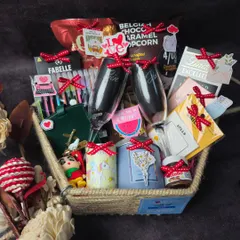 A beautiful couple's hamper filled with personalized items, snacks, and keepsakes to celebrate your unique bond.